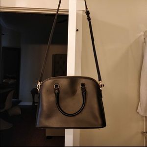 Linjer black leather cross body.